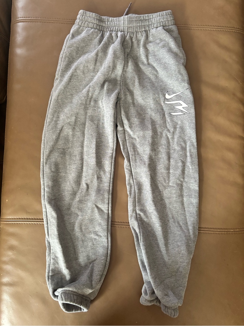 Nike Gray Fleece Kids Joggers with White Swoosh